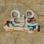 Load image into Gallery viewer, Inuit Kissing and Sledging in the Snow Glass Decoraton
