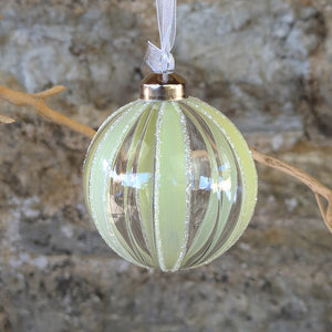 Glass Bauble with vertical stripe in pale greenwith glitter edges